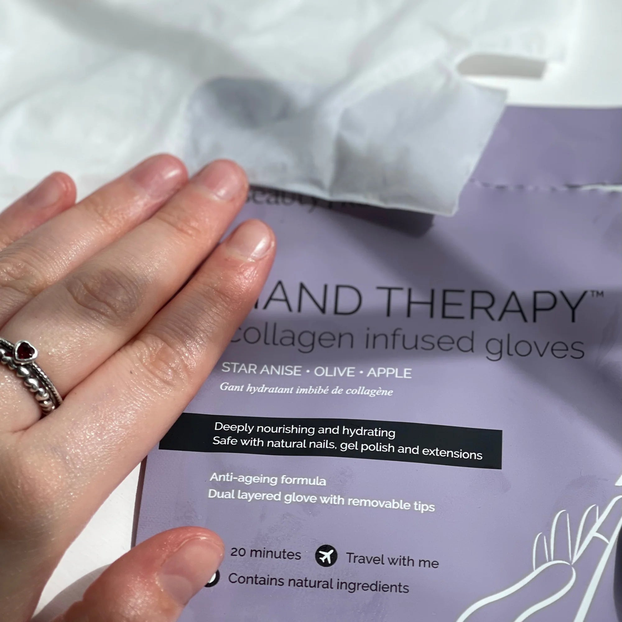 Applying BeautyPro hand therapy glove treatment for soft, hydrated skin