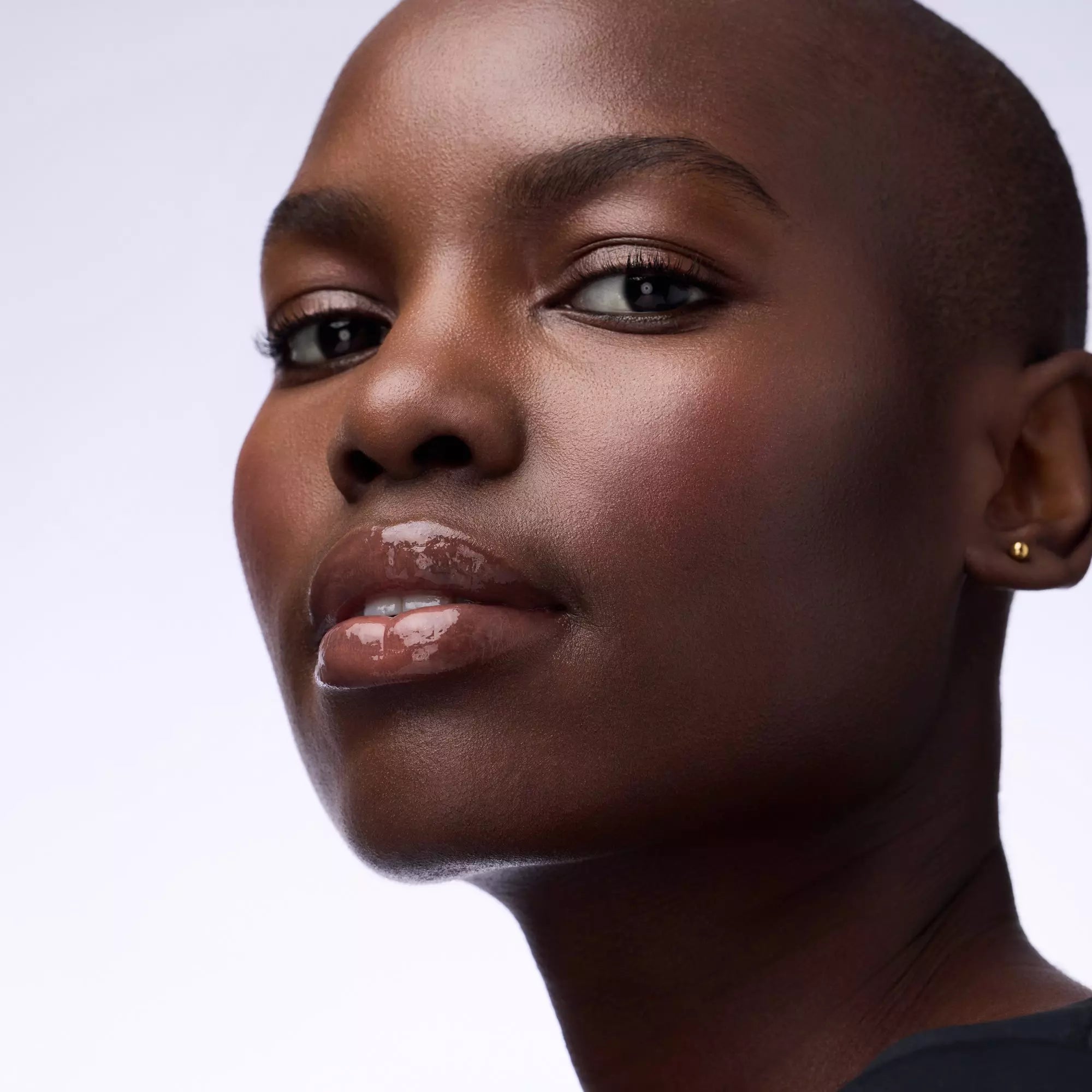 Catrice Butter Drippin’ Glossy Lip Balm 020 Maple Latte natural nude tint on dark skin