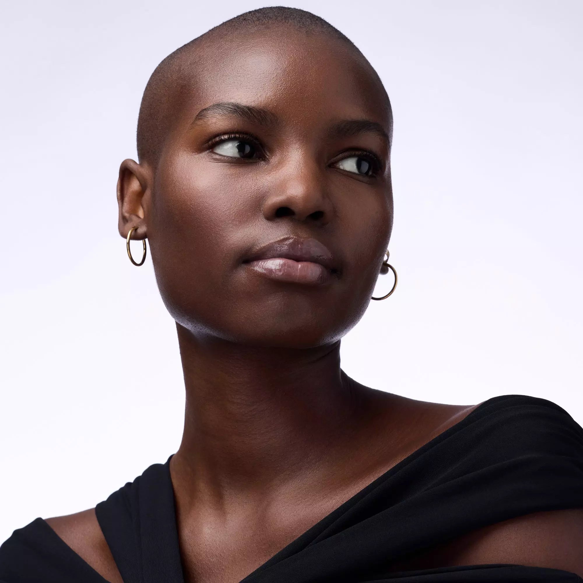 Model wearing Catrice Berry Bravest pink gloss