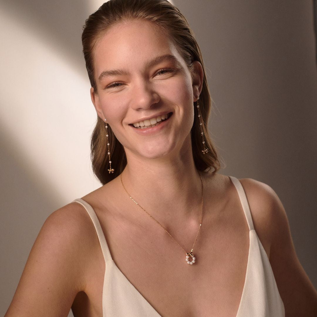 Gold bow and pearl circle pendant from the Tipperary Crystal Bow Collection