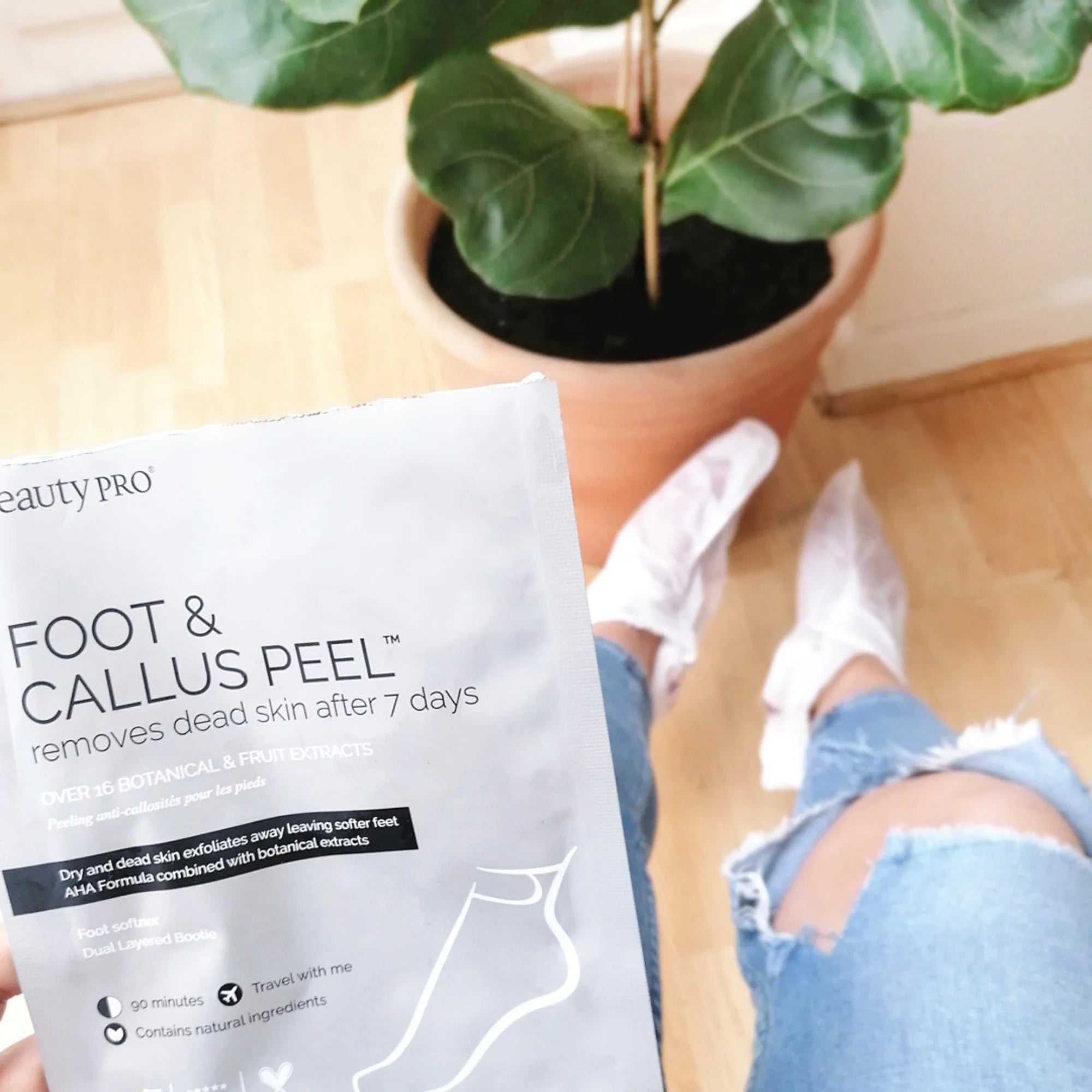 User wearing exfoliating foot socks from BeautyPro