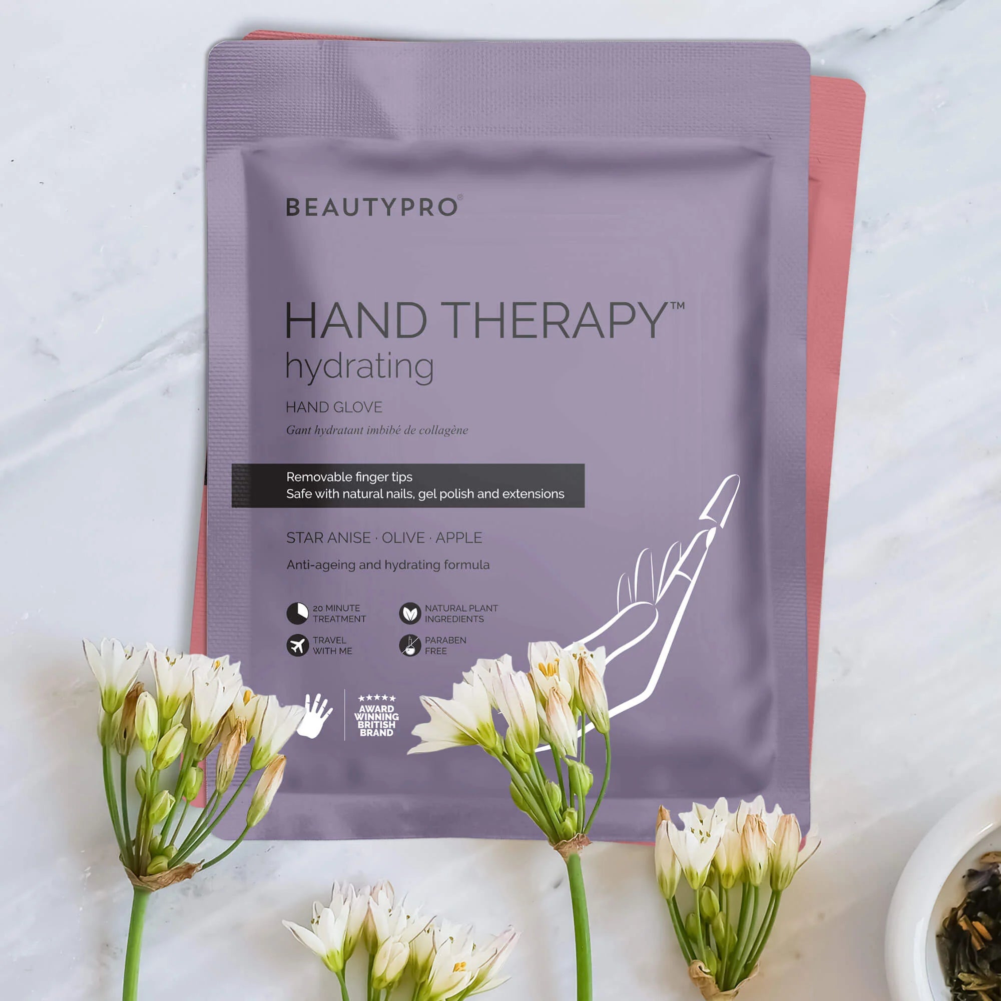 BeautyPro Hand Therapy Hydrating Hand Glove pack styled with fresh flowers