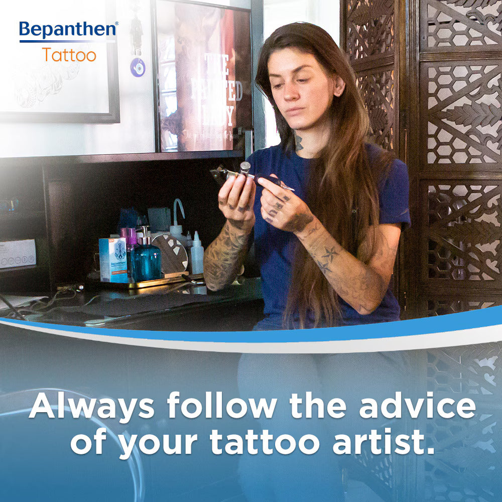 Tattoo artist recommending Bepanthen Tattoo Ointment for fresh ink aftercare