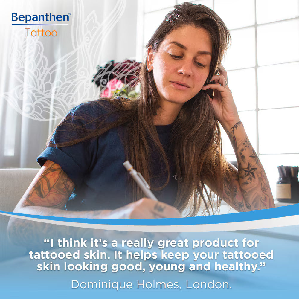 Tattooed woman using Bepanthen aftercare for healthy, vibrant ink