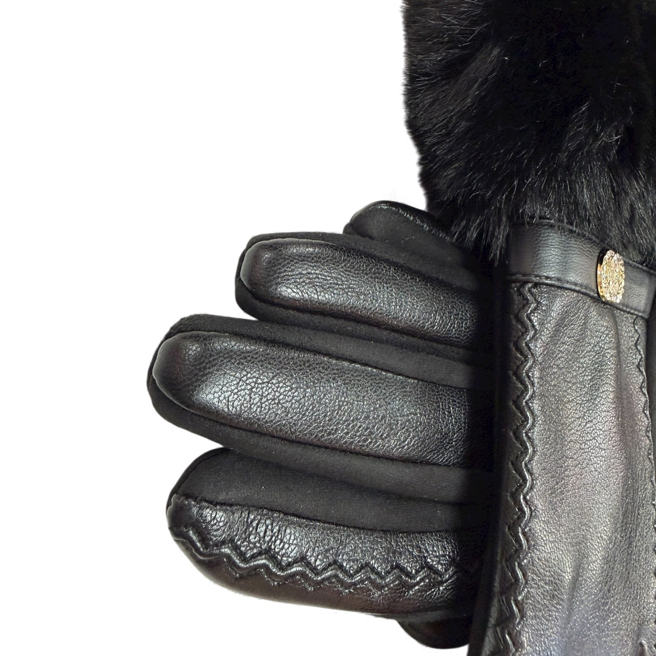Close-up of black gloves showing faux fur cuff and gold detail