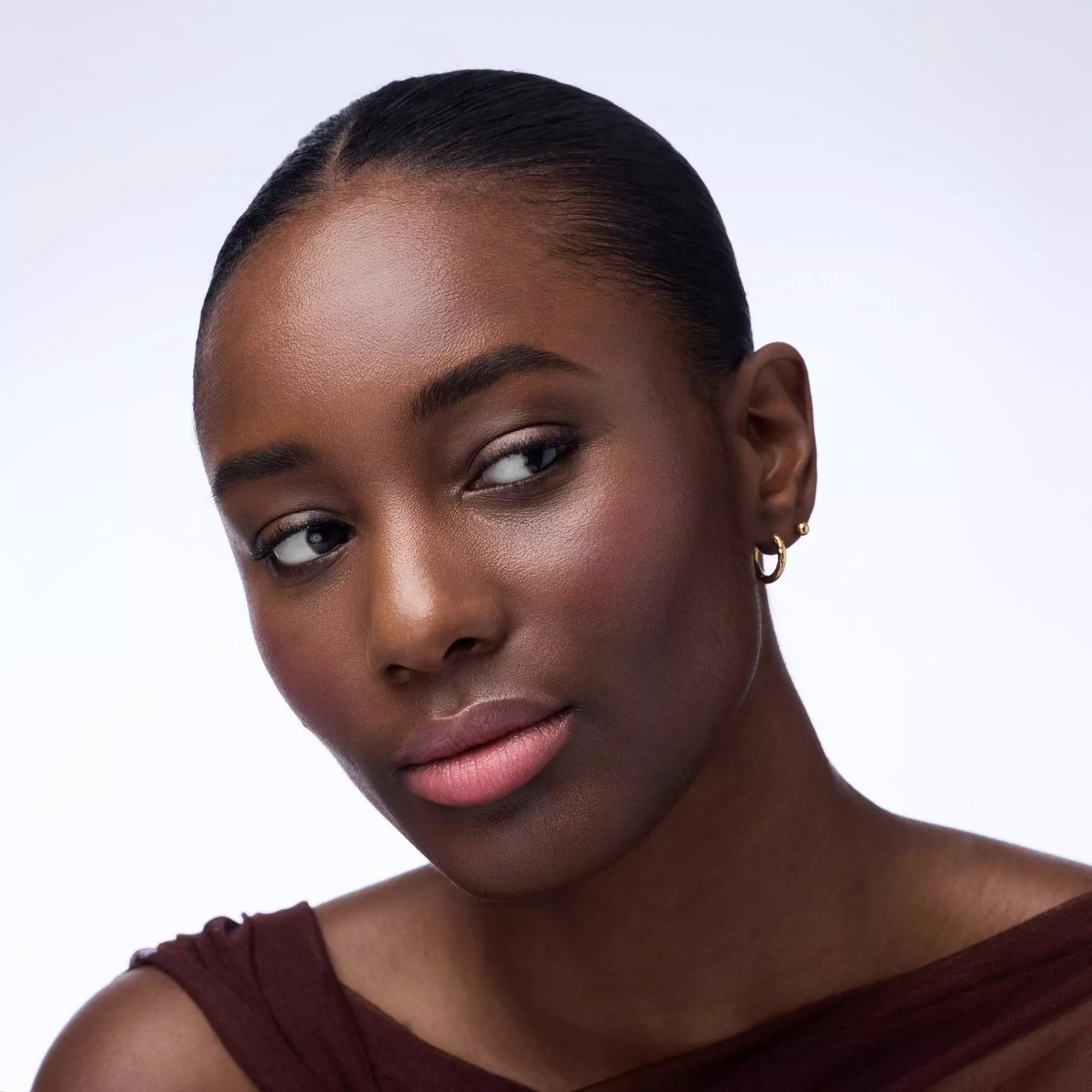 Dark Skin Model Wearing Catrice Blushin’ Charm Multi Stick Pink Sweetheart on Lips