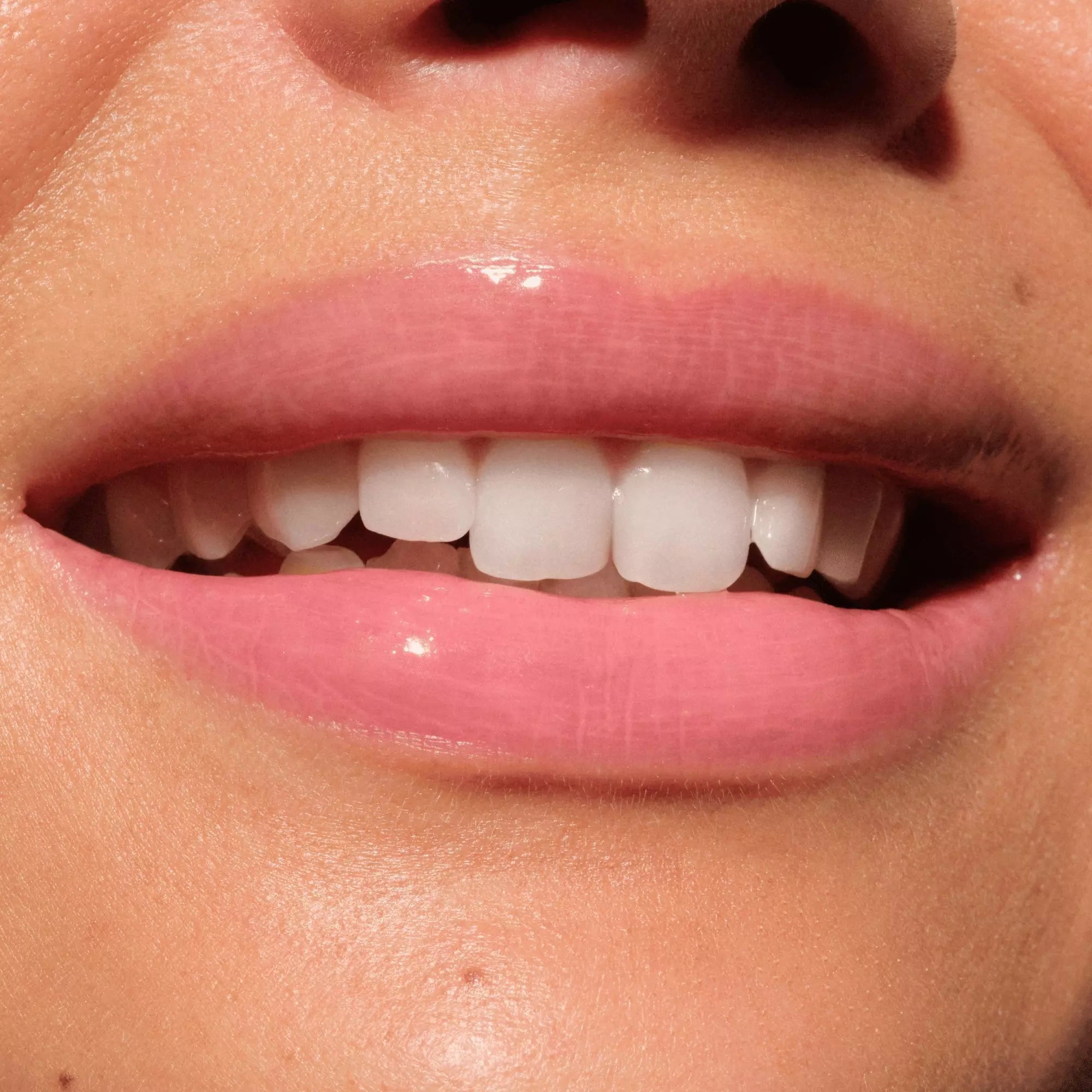 Pink Lemon Squeezin’ Catrice Lip Balm with high-gloss finish and clean vegan formula
