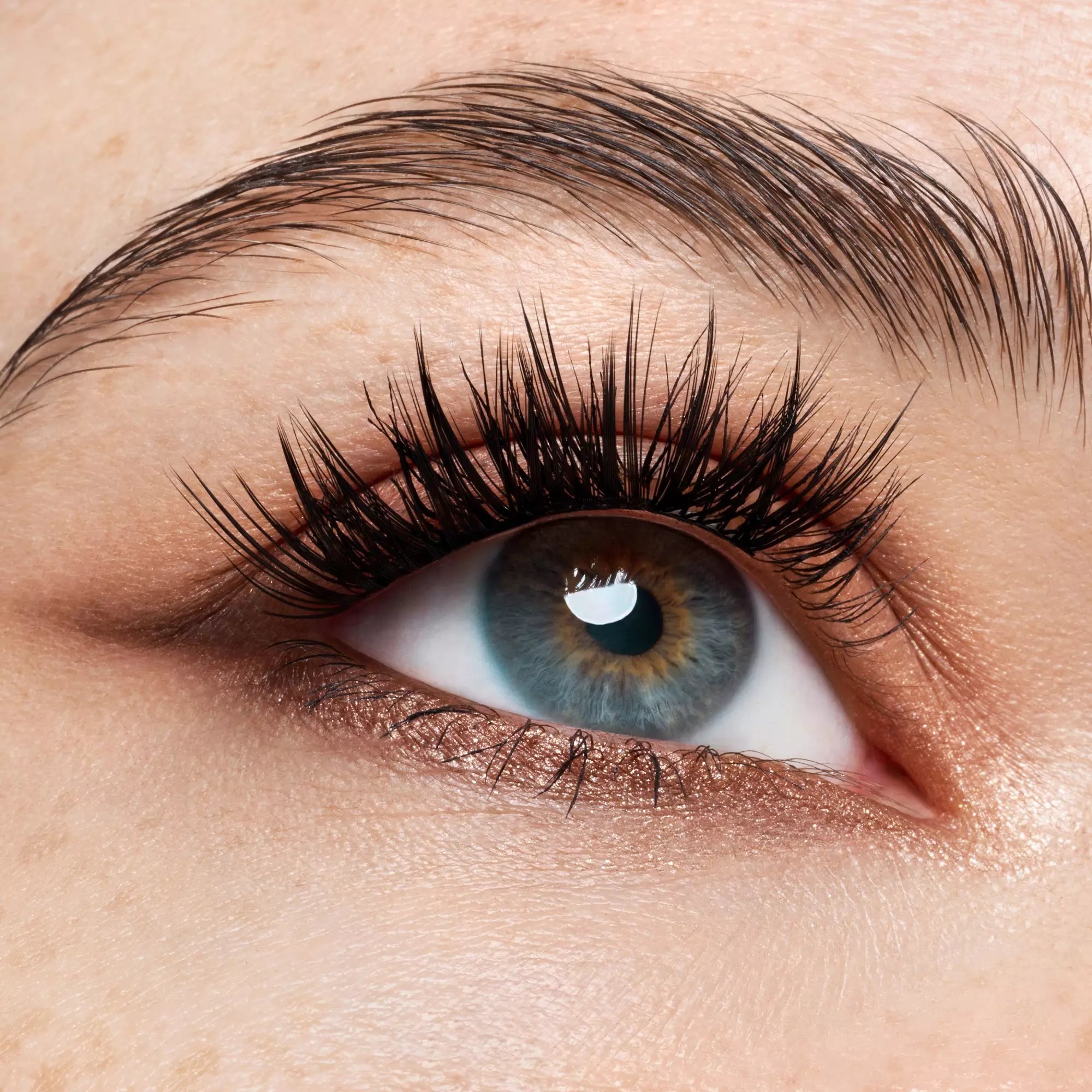 Jet-black Catrice lash clusters applied for full volume effect – close-up on eyes