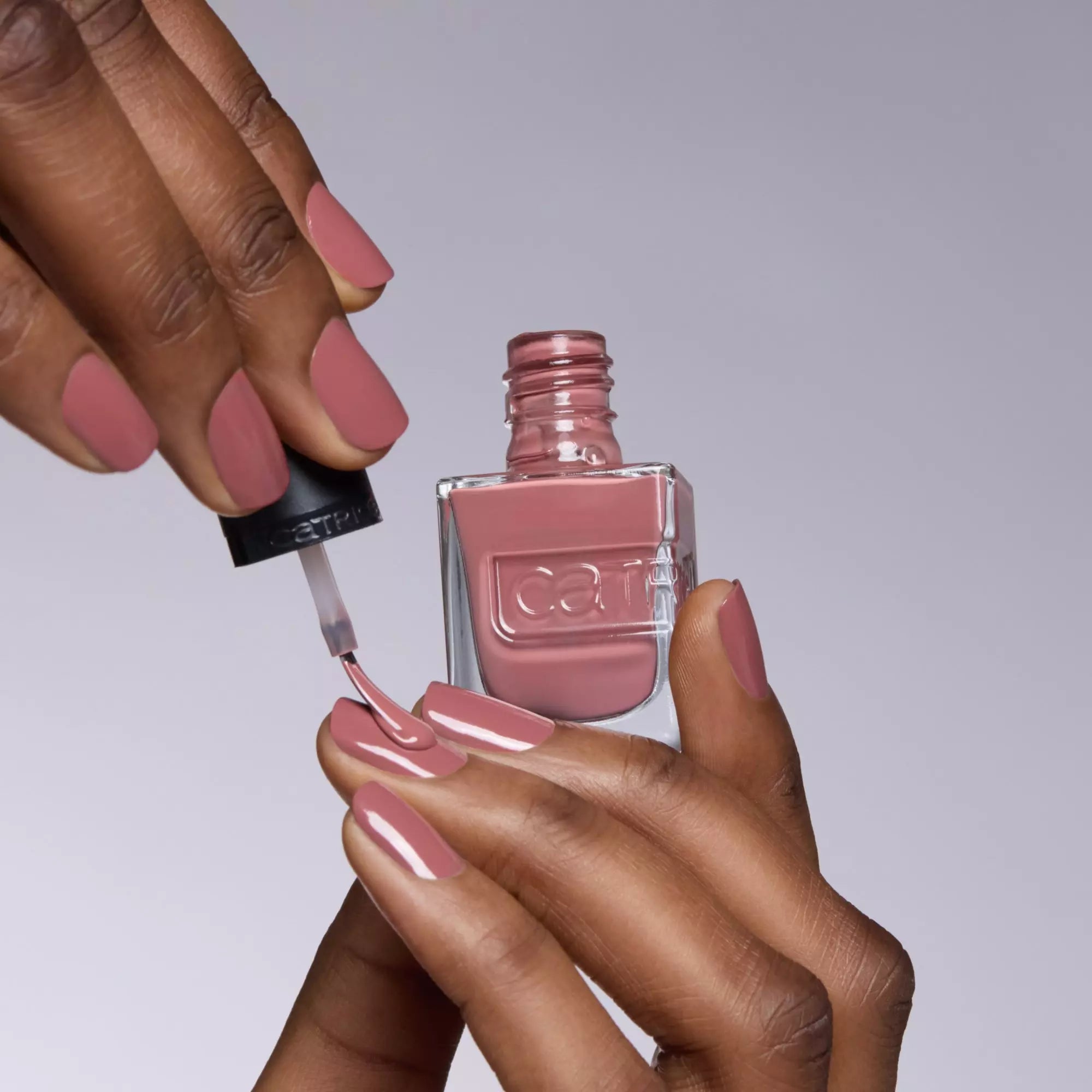 Applying rosy nude gel-effect polish – Catrice 008 nail lacquer