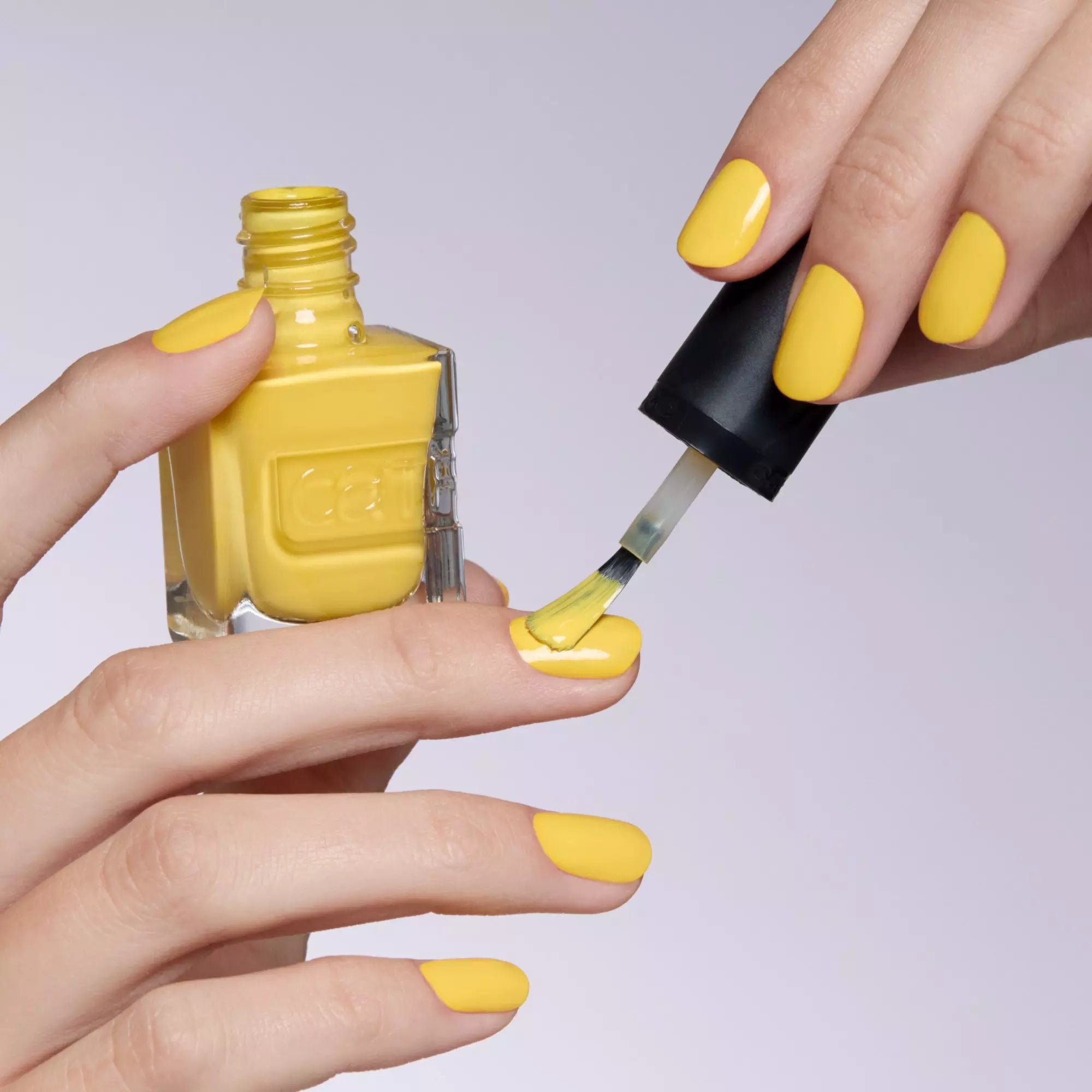 Applying Catrice yellow nail polish – To Bee Or Not To Bee gel look