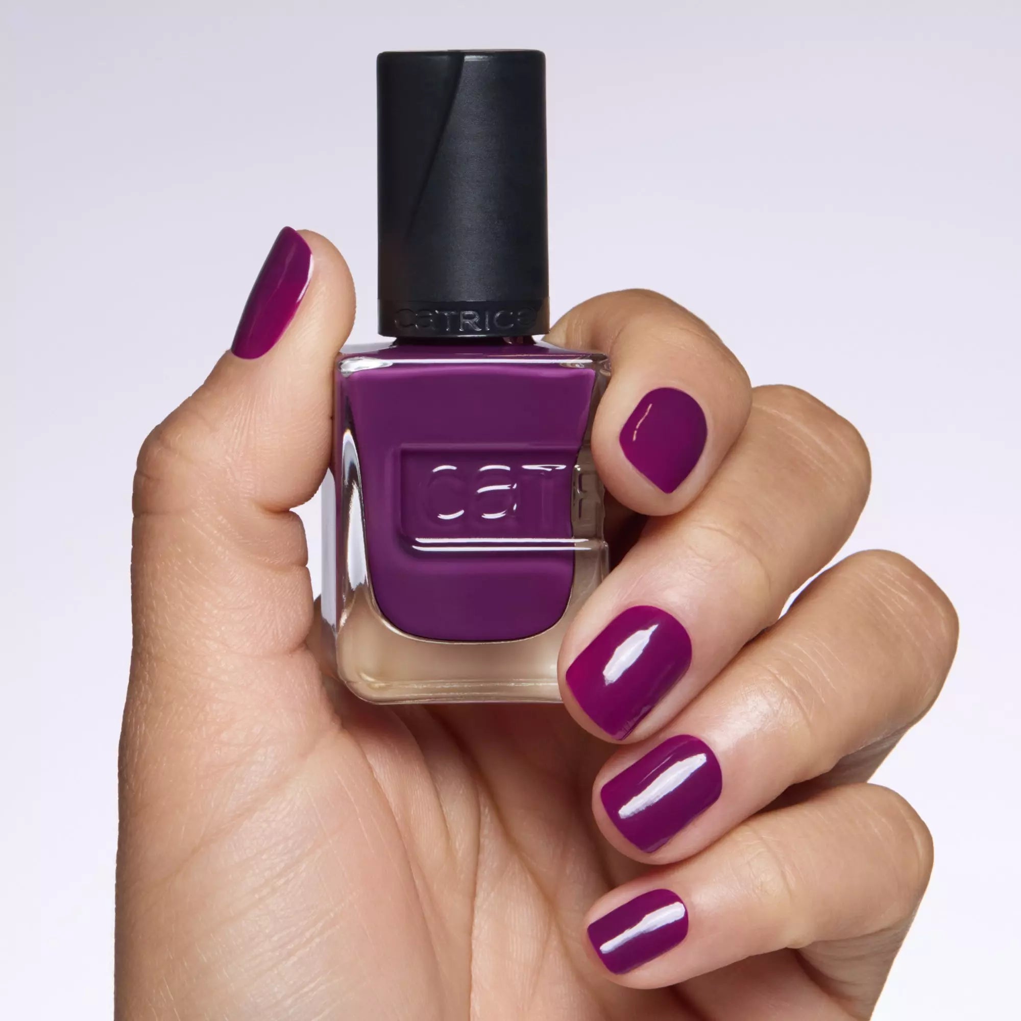 Applying Catrice Plum-Believable Nail Lacquer for Gel-Like Dark Purple Finish