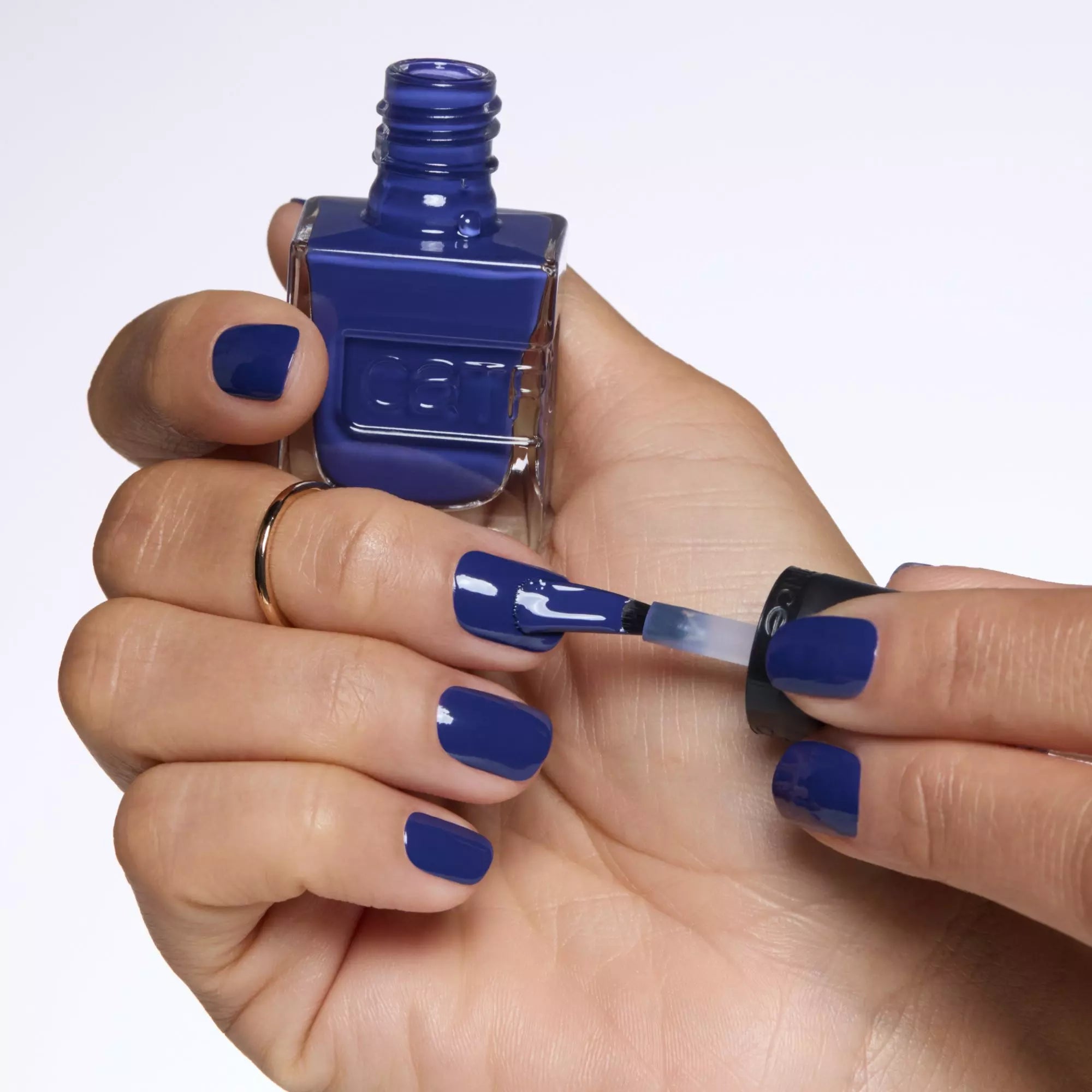 Applying Catrice Midnight Dusk Nail Polish for Gel-Like Dark Blue Finish