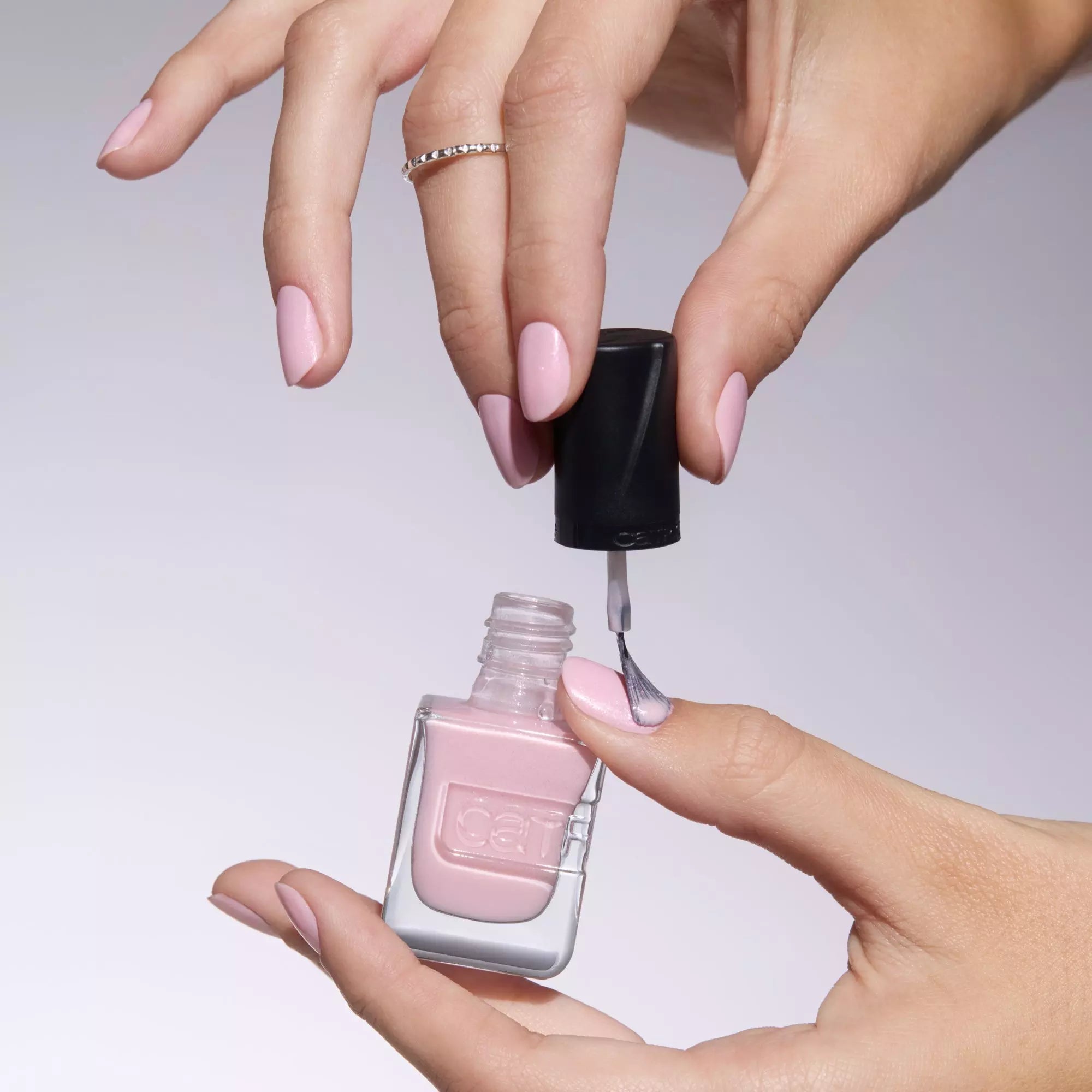 Applying Catrice Gel Affair Nail Lacquer soft pink nail polish