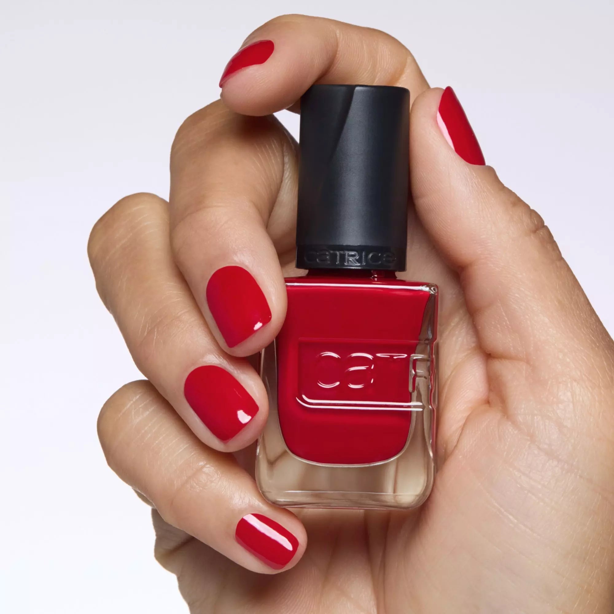 Applying Catrice Gel Affair bright red nail lacquer for a flawless gel finish
