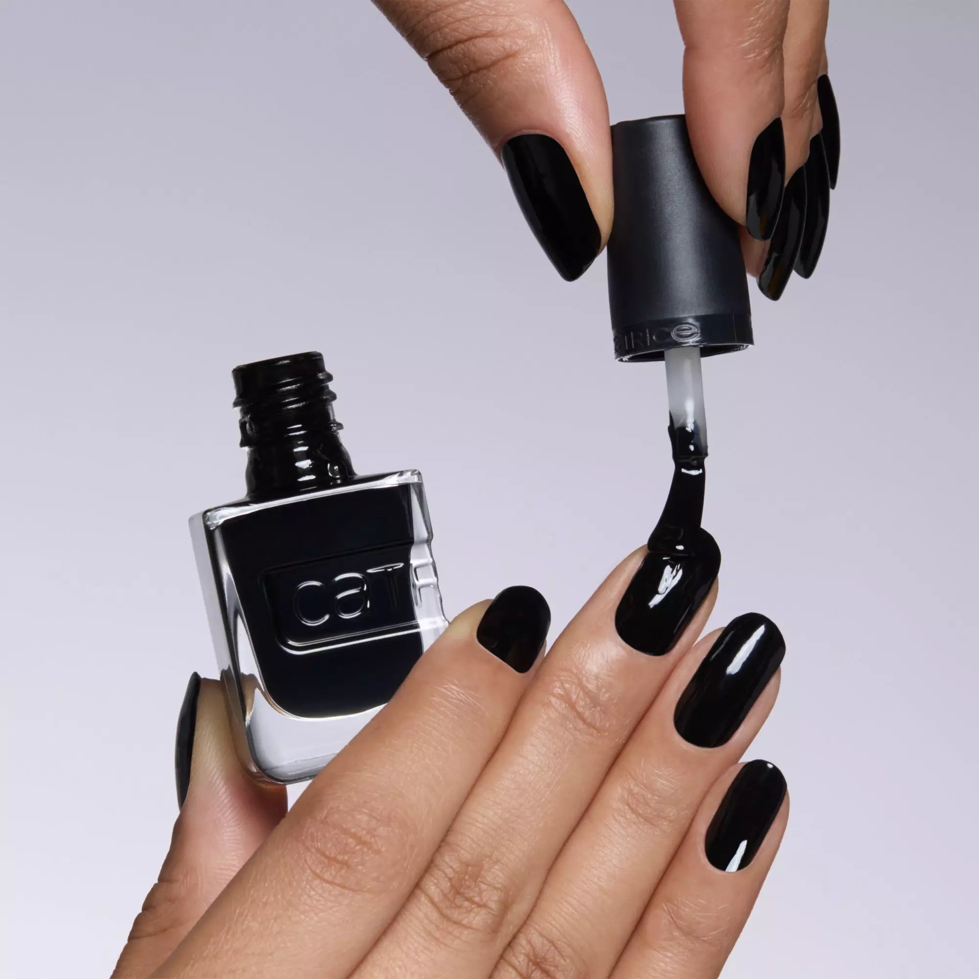 Applying Catrice Gel Affair Black To The Roots nail lacquer for glossy, salon-quality black nails
