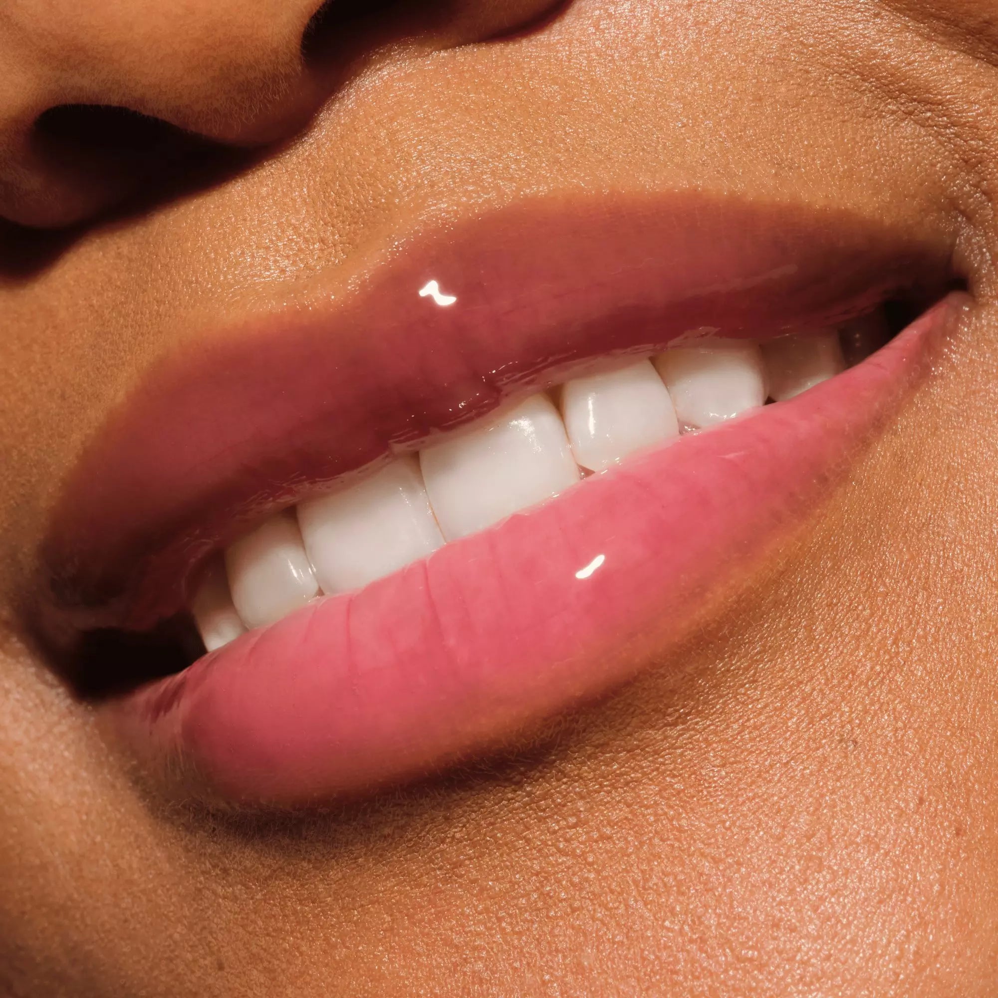 	Catrice Glossin’ Glow pink lip oil 070 Make A Move glossy finish on lips