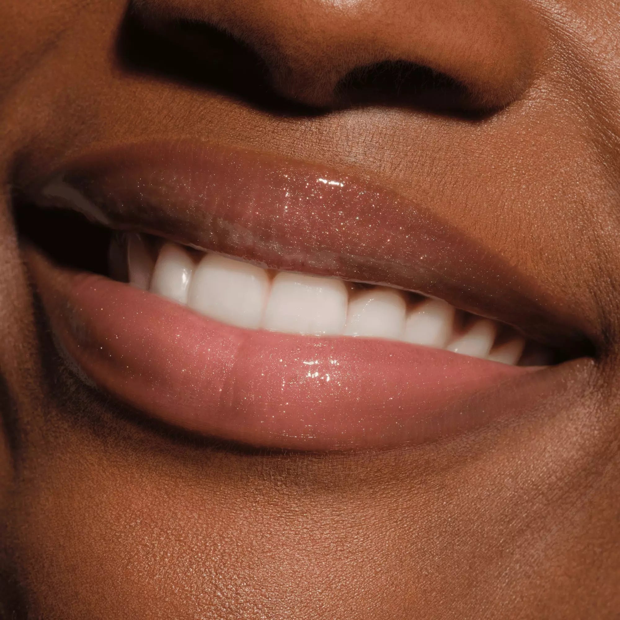 Catrice Max It Up Lip Booster 070 on deep skin – glossy lips with luminous pink finish