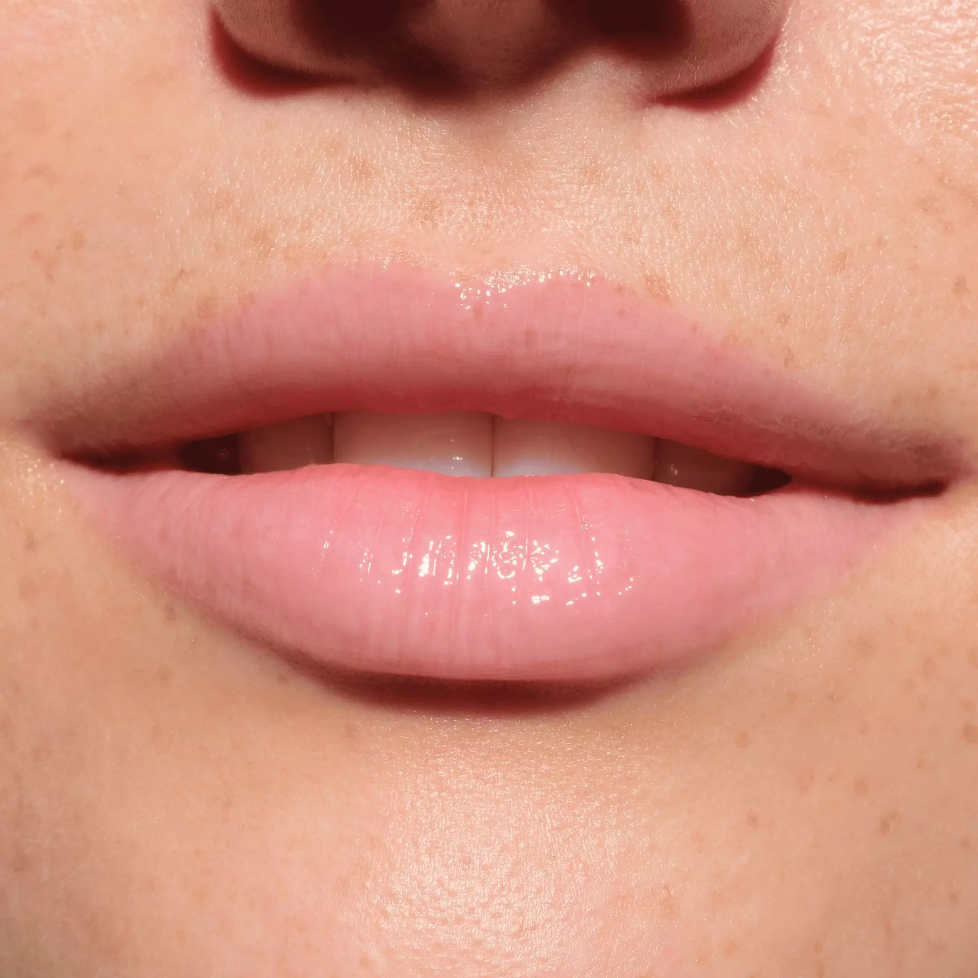 Catrice More Amore pink plumping gloss on fair skin – shiny and hydrating finish
