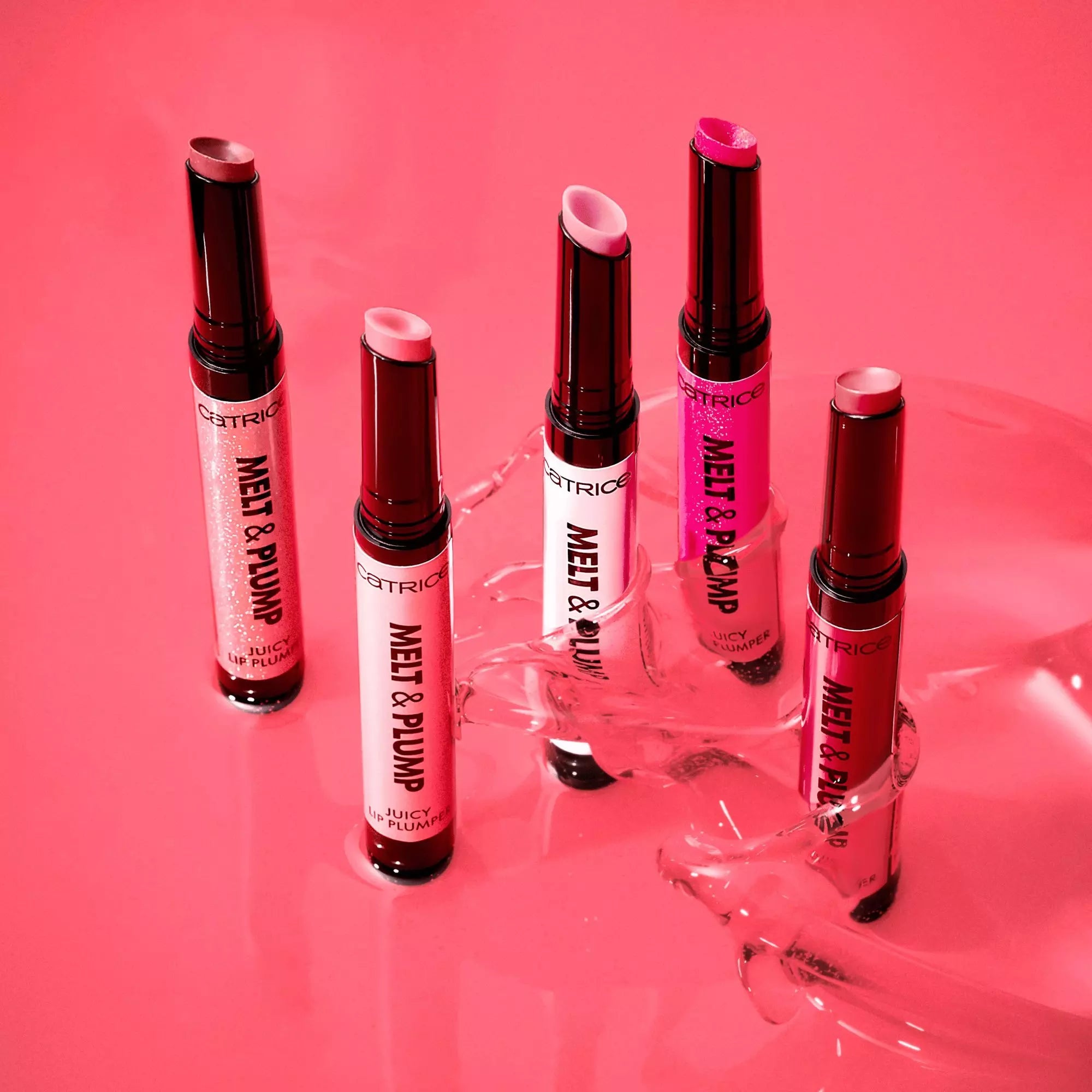 Catrice Melt & Plump Lip Plumper collection displayed on liquid gloss background