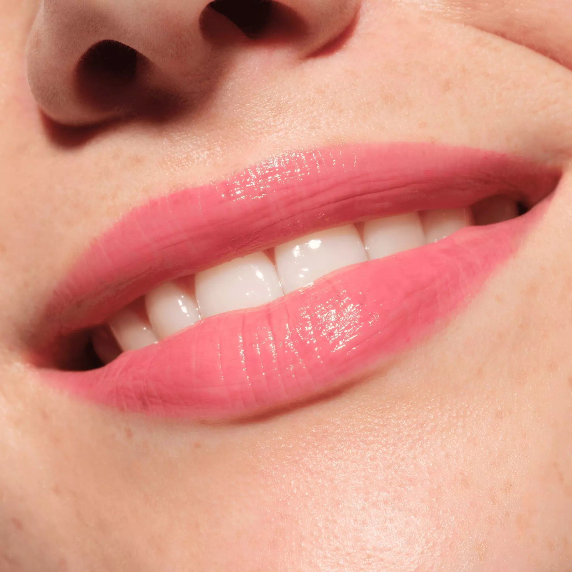 Close-up of lips with glossy pink berry Catrice Melt & Plump shade 040
