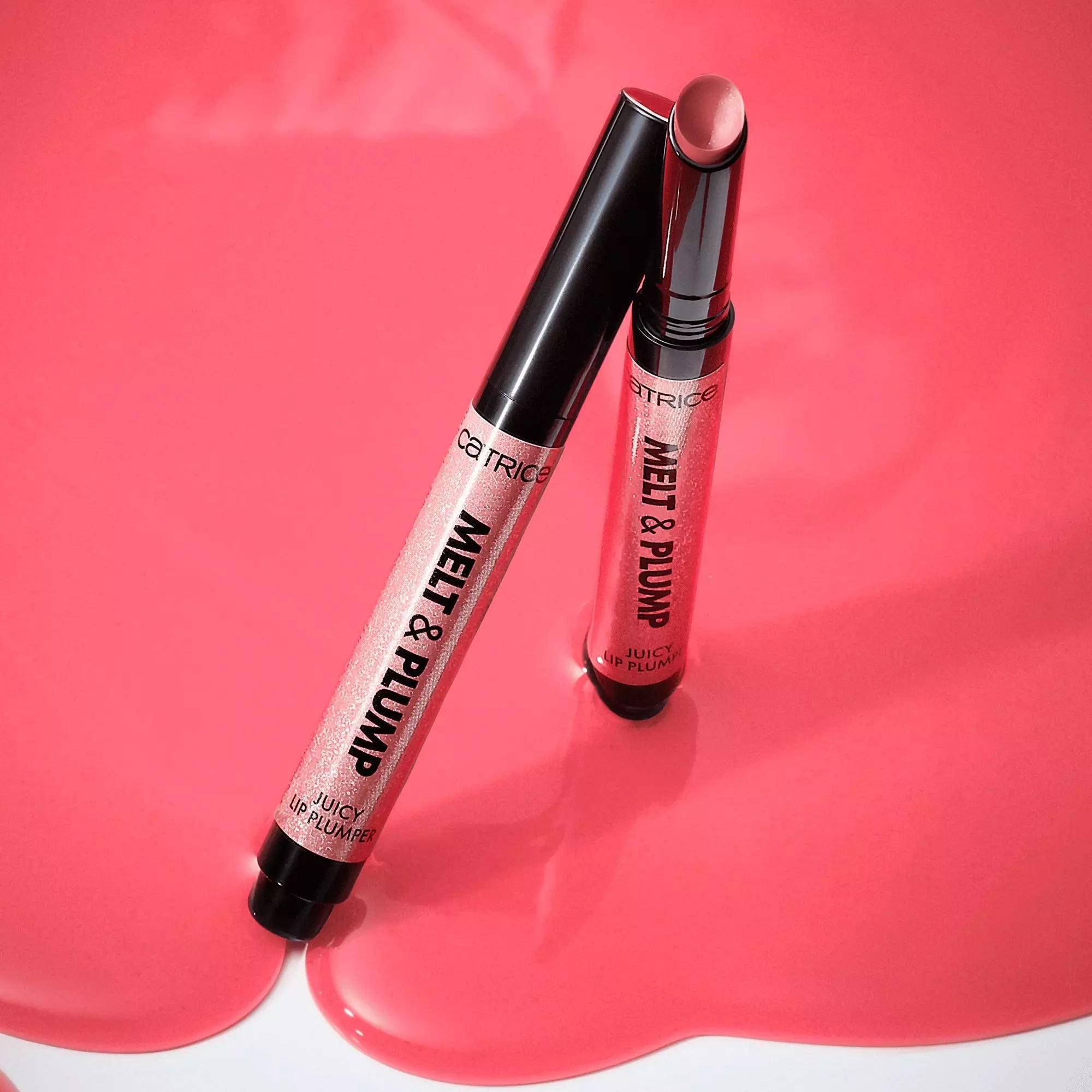 Catrice Melt & Plump Lip Plumper pens displayed on pink background
