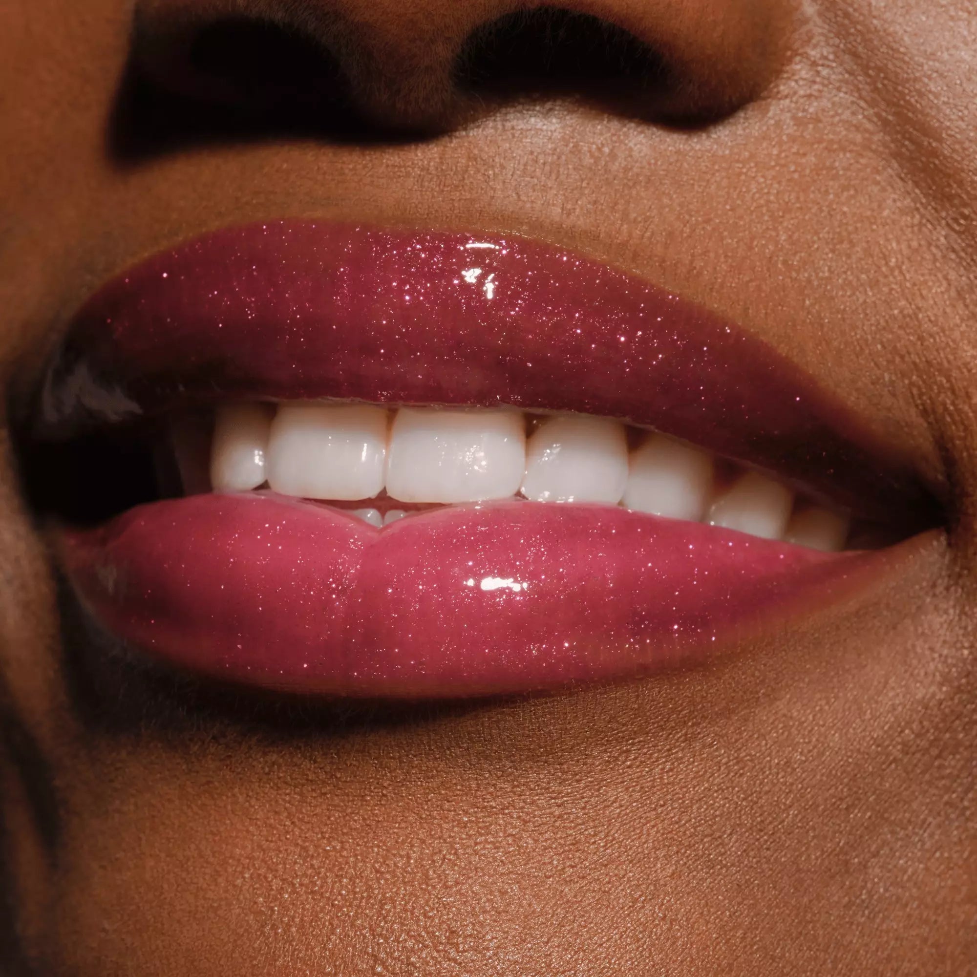 Model lips with plumping Catrice lip gloss in Self Love & Glitter