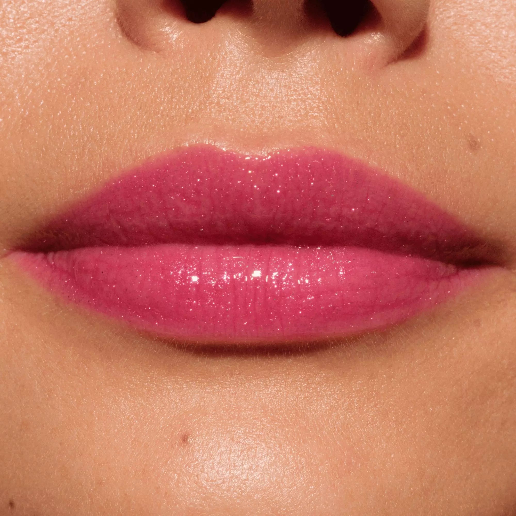Model lips with pink plumping gloss finish – shade 110