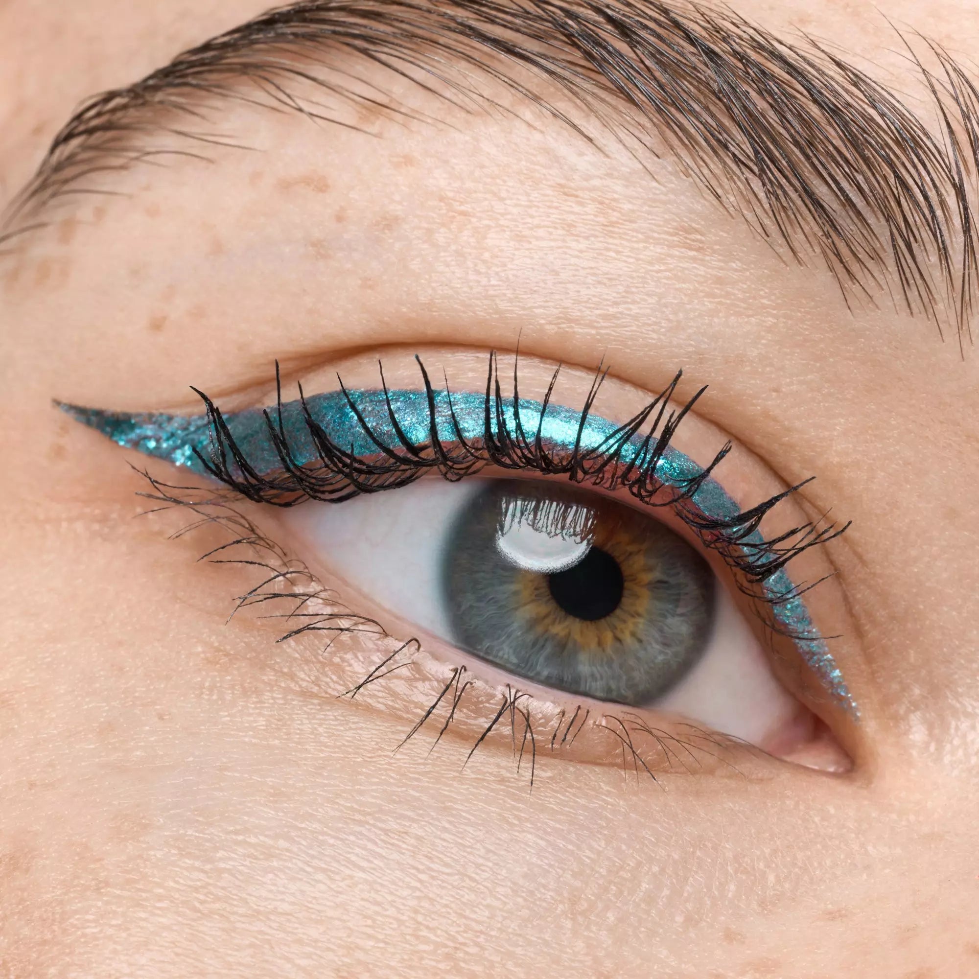 Winged eyeliner makeup using Catrice Cosmic Chrome liner on hazel eyes