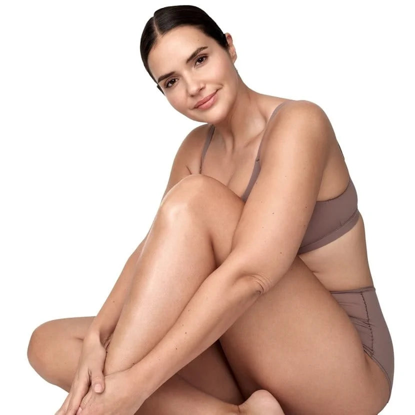 Model with smooth skin after using Eucerin UreaRepair Shower Gel
