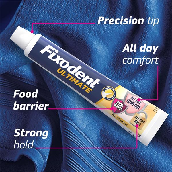 Fixodent Ultimate denture adhesive – precision tip close-up with food barrier and all-day hold