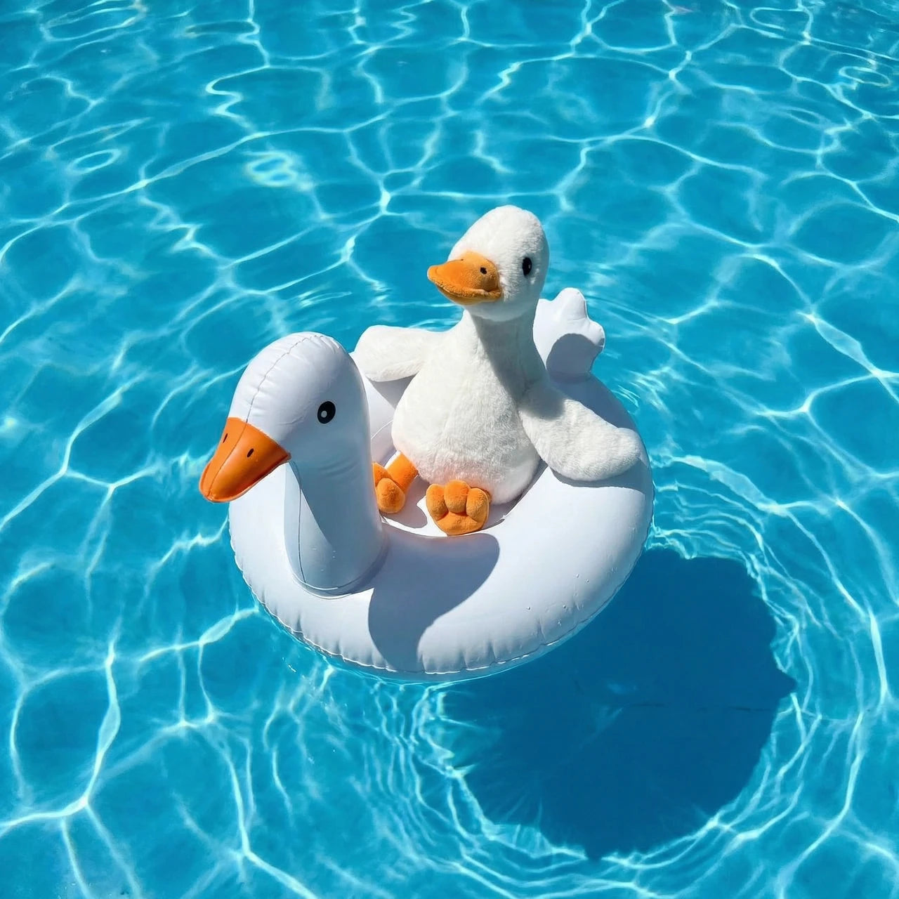 Gosh Goose plush toy floating on inflatable ring in swimming pool