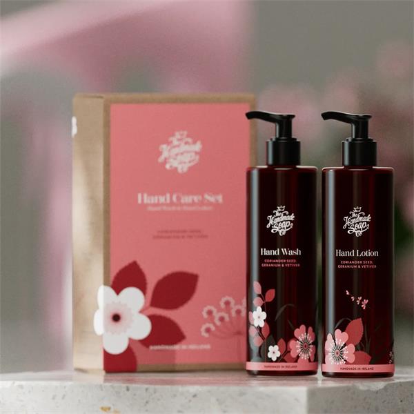 The Handmade Soap Co. Coriander Seed, Geranium & Vetiver Hand Care Gift Set displayed with two matching bottles in a lifestyle setting