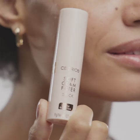 Close-up of woman using Catrice Soft Glam Filter Stick 040 Medium Tan on cheek