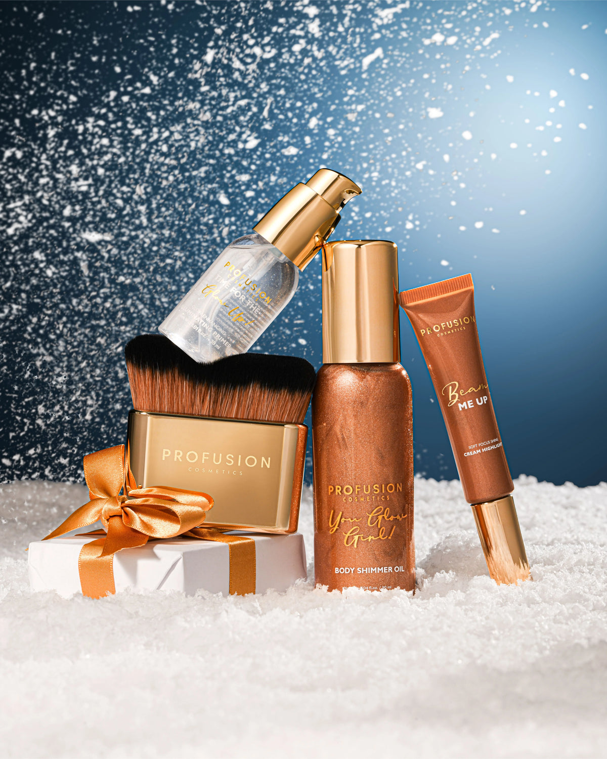Profusion You Glow Girl Body Shimmer Gift Set displayed with golden makeup products and brush in festive setting