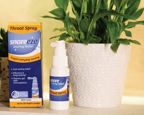 Snoreeze Throat Spray on bedside table for nightly snoring treatment