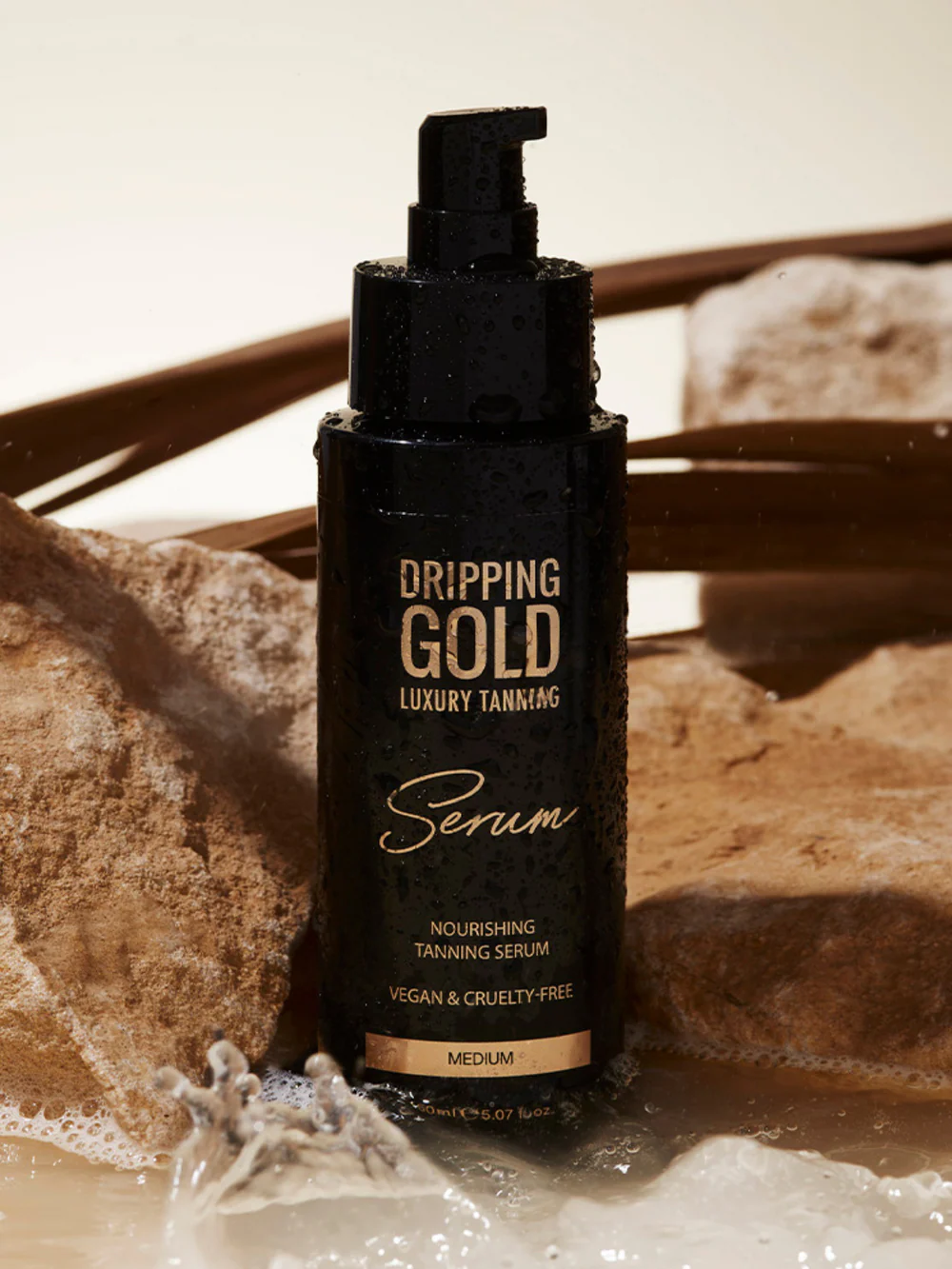 Sosu Dripping Gold serum bottle placed on neutral background