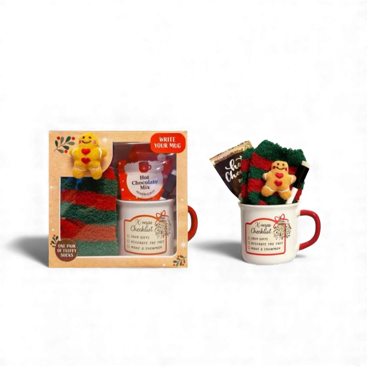 Festive gift box containing mug, marker and gingerbread socks on white background