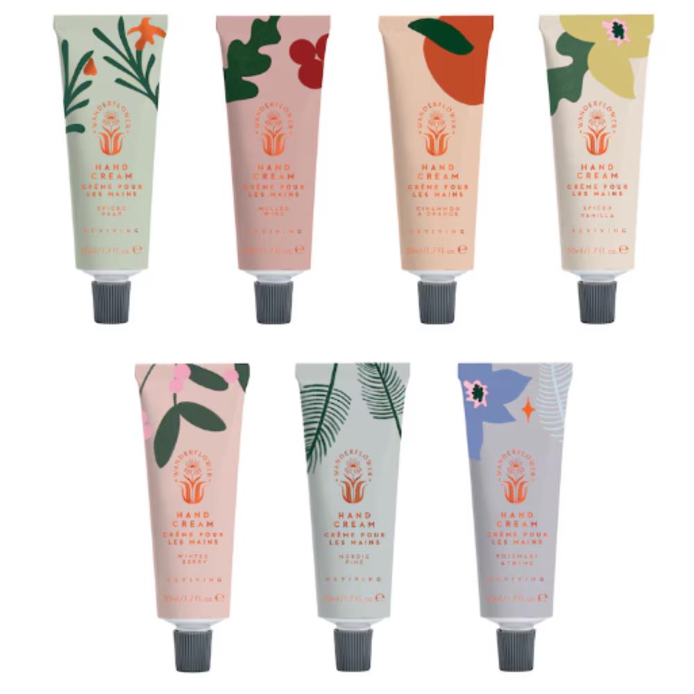 Seven Wanderflower hand cream tubes in mixed colours and fragrances on white background