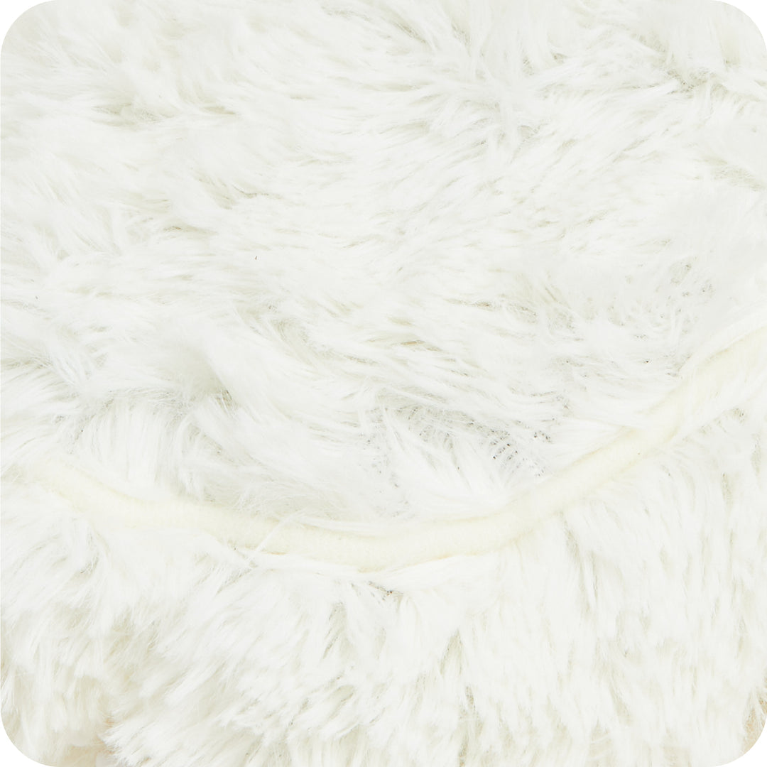 Warmies plush close-up — cream fur texture and lavender-scented filling detail on microwavable slippers.