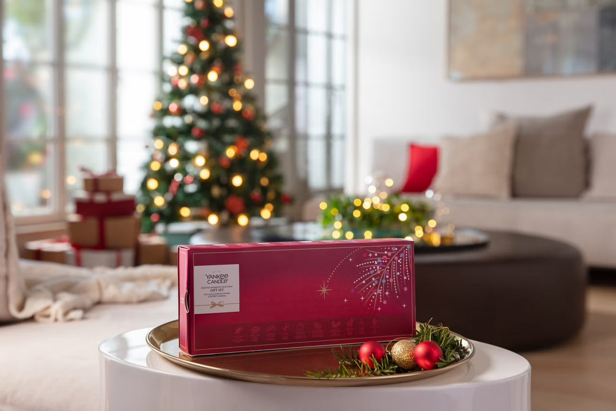 Yankee Candle Scented Moments Gift Set displayed beside a Christmas tree